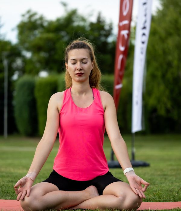 Woman in a calm yoga pose, embodying inner harmony.