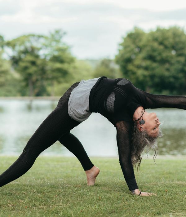 Woman performing an energetic yoga pose, full of vitality.